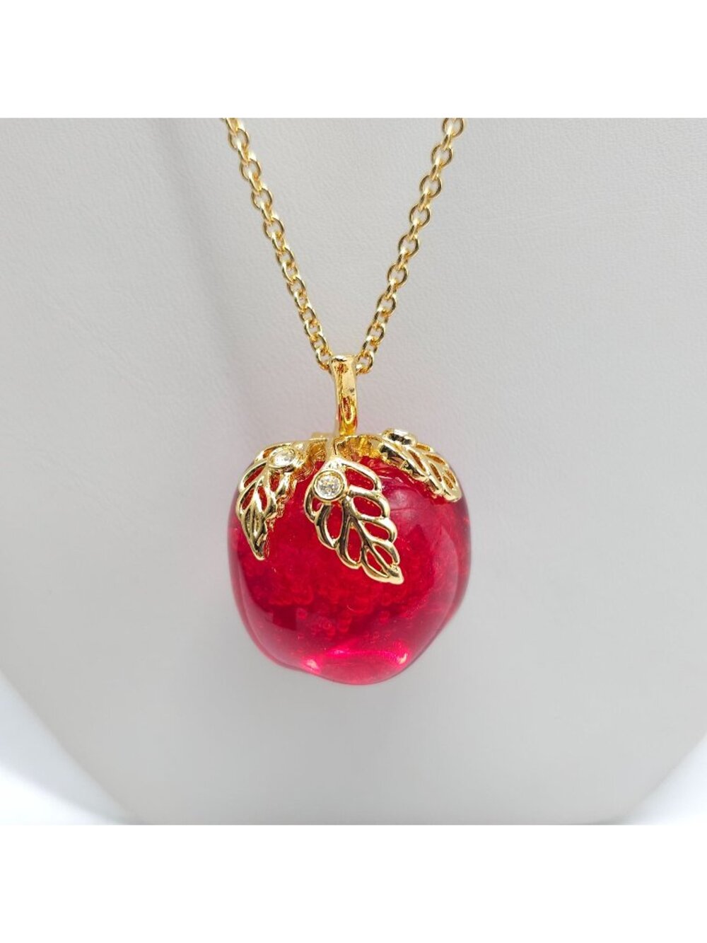 Avon Apple Shaped Red Resin Pendant Necklace With Gold Tone Chain Leaf Accents